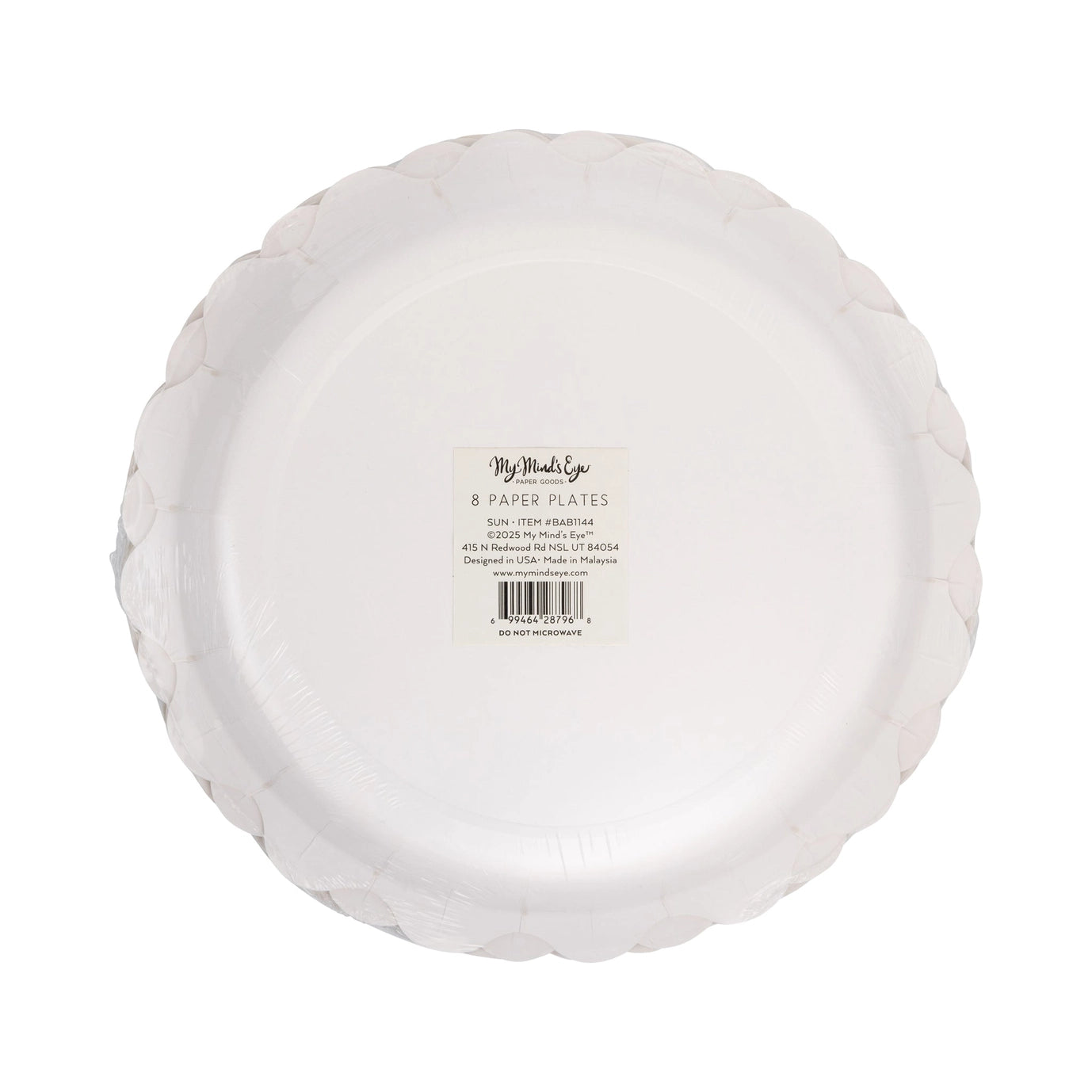 Stack of white paper plates with a label on a white background