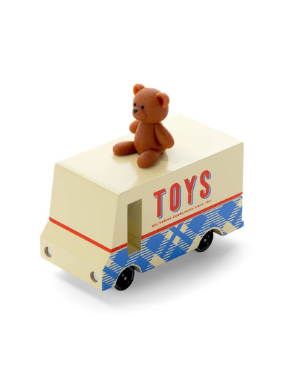Toy truck with a teddy bear on top, labeled 'TOYS', on a white background