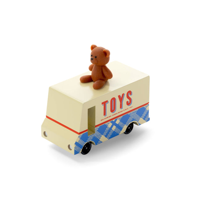 Toy truck with a teddy bear on top, labeled 'TOYS', on a white background
