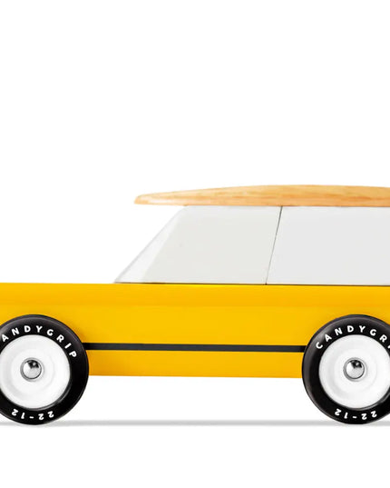 Toy car with a wooden surfboard on top and 'Candygrip' tires on a white background