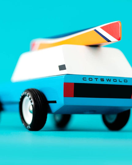 Toy vehicle with 'Cotswold' branding on a blue background