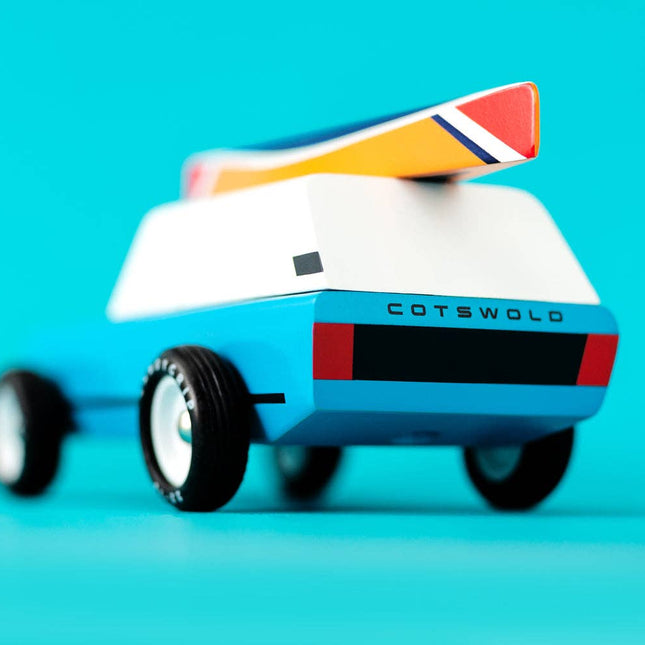 Toy vehicle with 'Cotswold' branding on a blue background