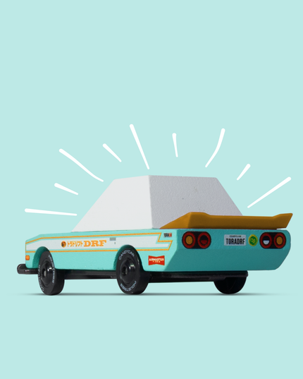 Toy car with a light blue background
