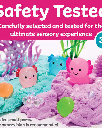Toy set with colorful sea creatures and coral on a pink background, labeled 'Safety Tested' and '3+'.