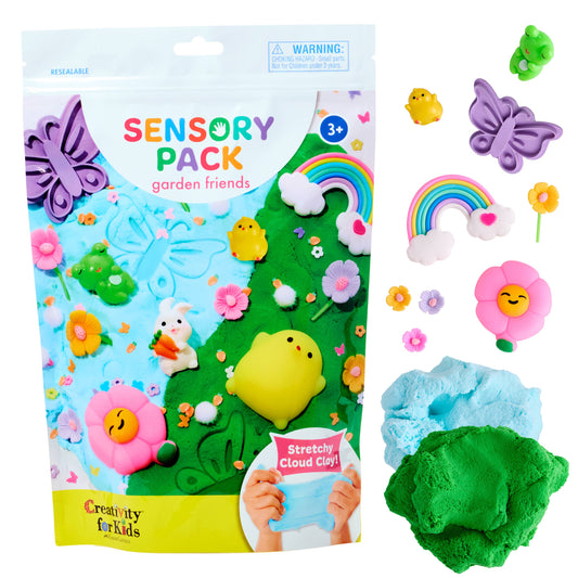 Sensory pack with garden-themed toys and playdough, featuring a colorful package and various toys on a white background.