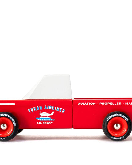 Red toy truck with white top and 'Yukon Airlines' branding on a white background