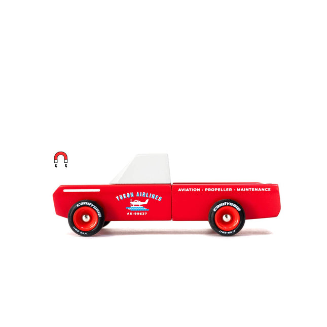 Red toy truck with white top and 'Yukon Airlines' branding on a white background