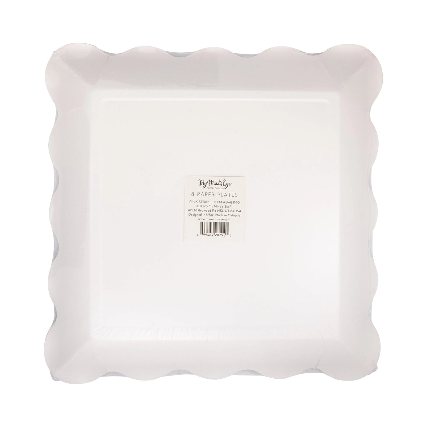 White paper plates with scalloped edge on a white background