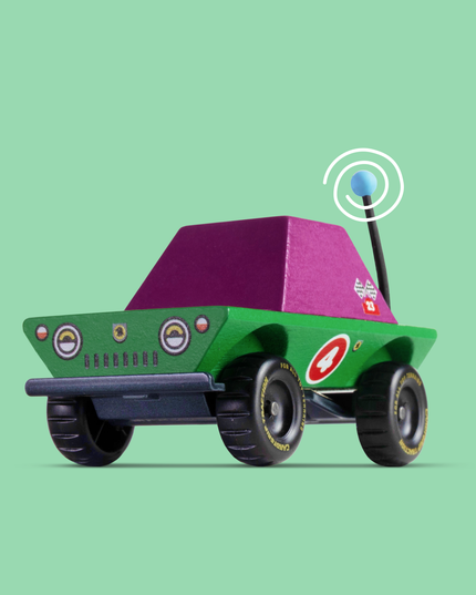 Toy car with a purple roof and antenna on a green background