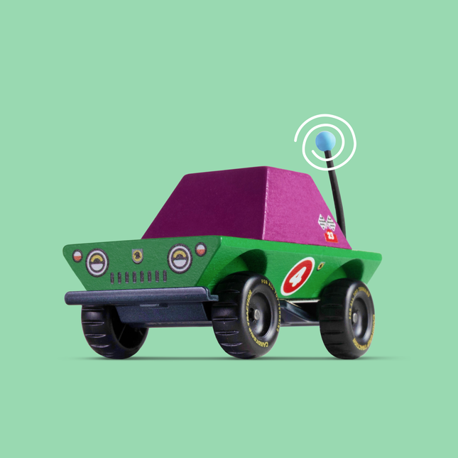 Toy car with a purple roof and antenna on a green background