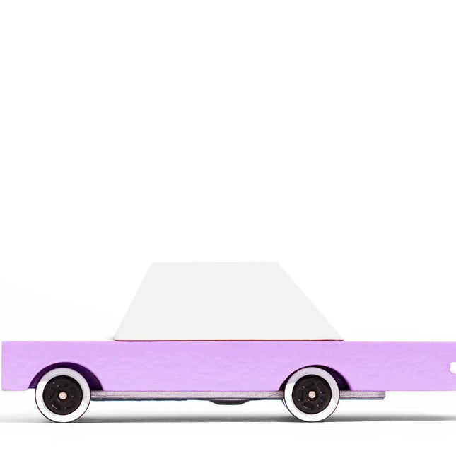 Toy car with a purple body and white top on a white background