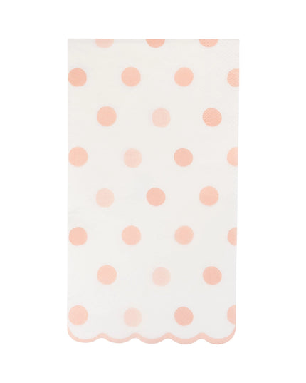 White napkin with pink polka dots on a white background