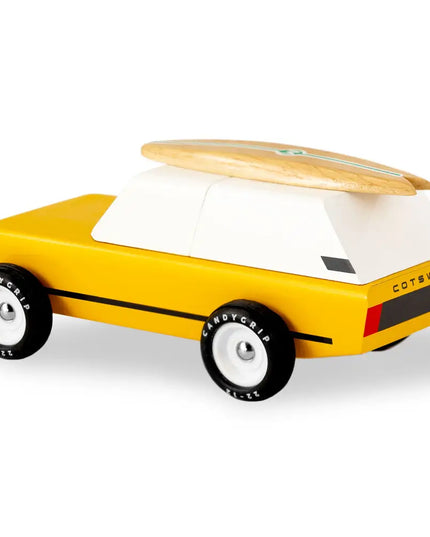 Yellow toy car with a wooden top on a white background