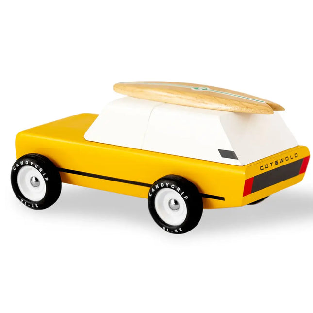 Yellow toy car with a wooden top on a white background