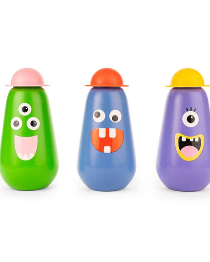 Three colorful bottles with cartoon faces on a white background