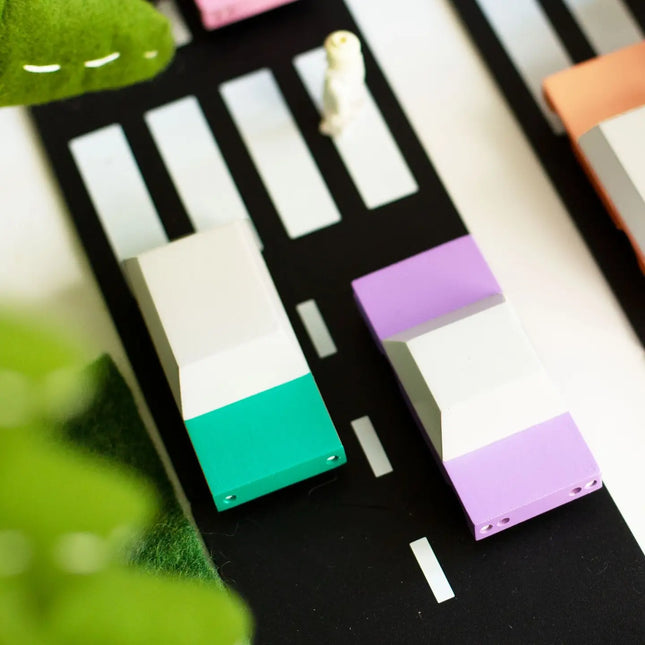 Colorful rectangular blocks on a black and white striped background