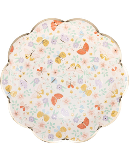 Round paper plate with floral and butterfly pattern on a white background