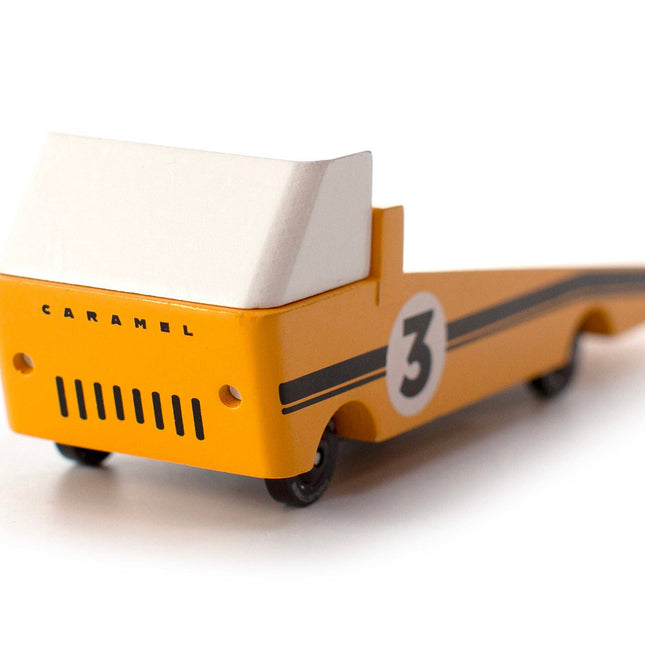 Toy truck with 'Caramel' branding and number '3' on a white background