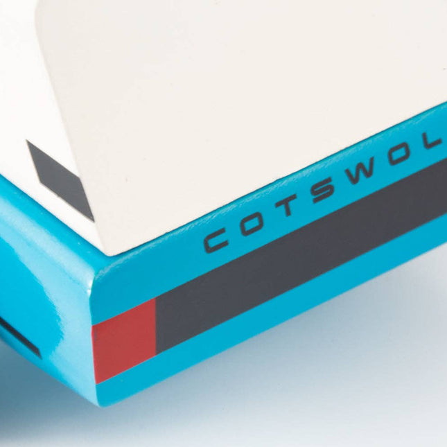 Close-up of a blue and white trailer with 'Cotswold' branding on a light gray background