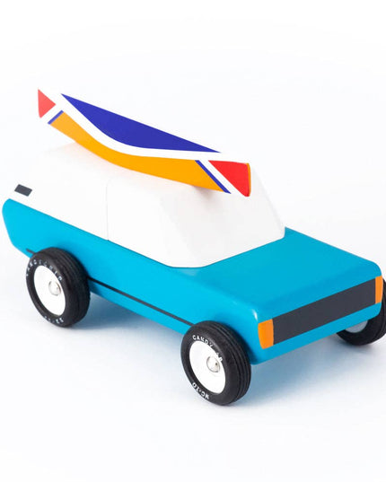 Toy car with a colorful rocket on top on a white background