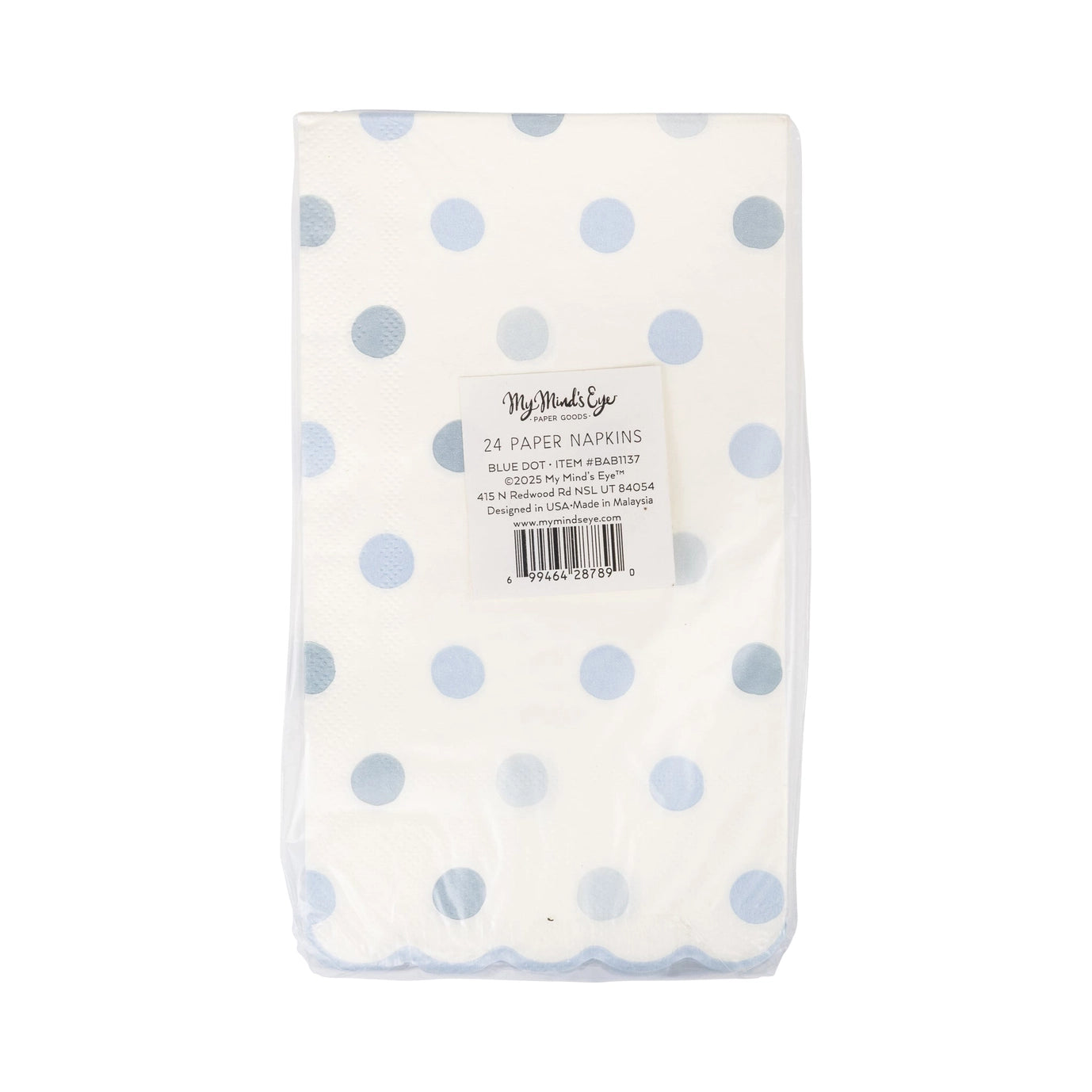 Pack of paper napkins with blue polka dots on a white background