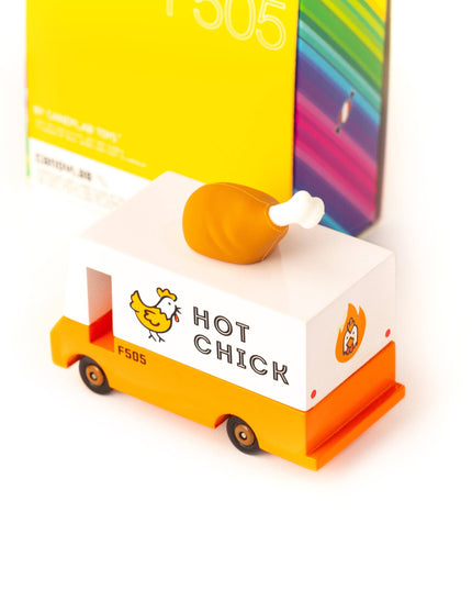 Toy truck with 'Hot Chick' branding and a box in the background