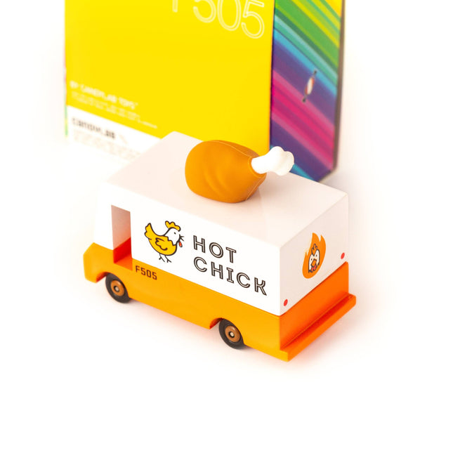 Toy truck with 'Hot Chick' branding and a box in the background