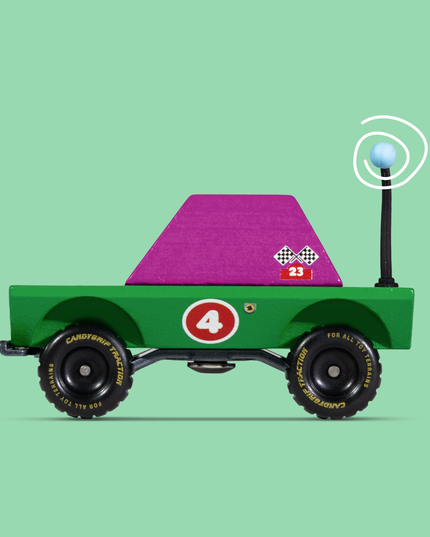 Toy truck with a purple flatbed on a green background