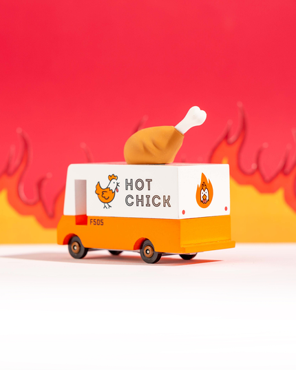 Toy van with a chicken on top, labeled 'Hot Chick', against a red and yellow background.