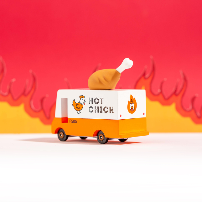 Toy van with a chicken on top, labeled 'Hot Chick', against a red and yellow background.