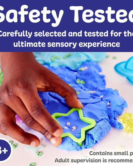 Child's hand playing with blue play dough using a green star-shaped tool, with text about safety testing and age recommendation.