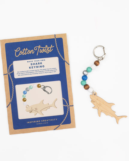 Cotton Twist shark keyring kit with wooden shark charm and bead chain on a white background