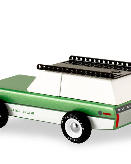 Green toy car with a black roof rack on a white background