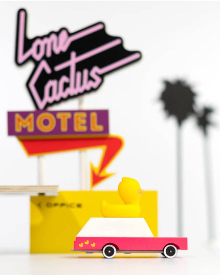 Decorative sign with 'Lone Cactus Motel' design on a white background