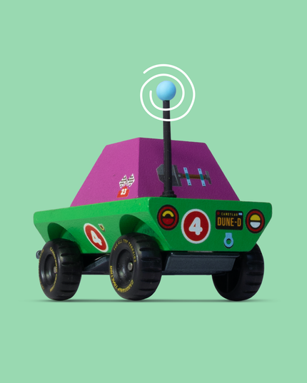 Toy robot with a purple top and green body on a light green background