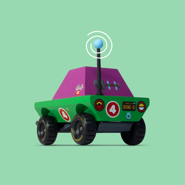 Toy robot with a purple top and green body on a light green background