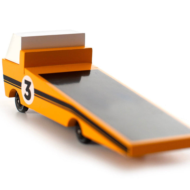 Toy car with a flatbed and number 3 on a white background