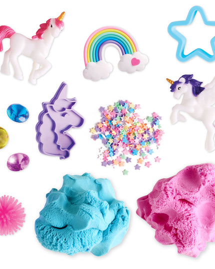 Collection of unicorn-themed toys and play materials including figures, sand, and molds on a white background.