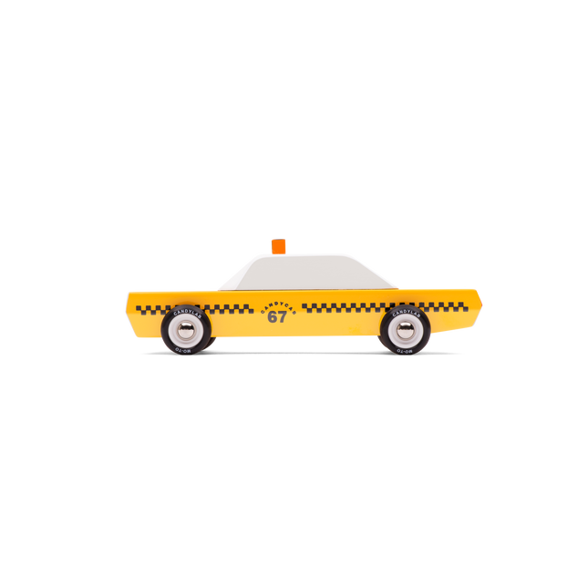 Toy taxi with a white top and yellow body on a white background