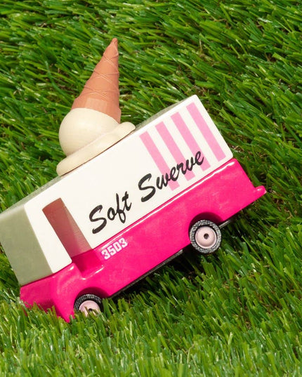 Toy ice cream truck with a cone on grass