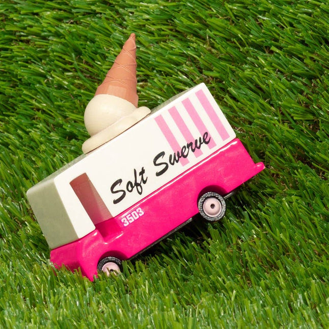 Toy ice cream truck with a cone on grass