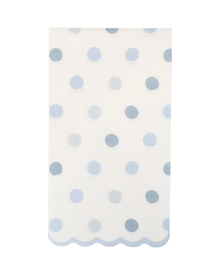 White napkin with blue polka dots on a white background