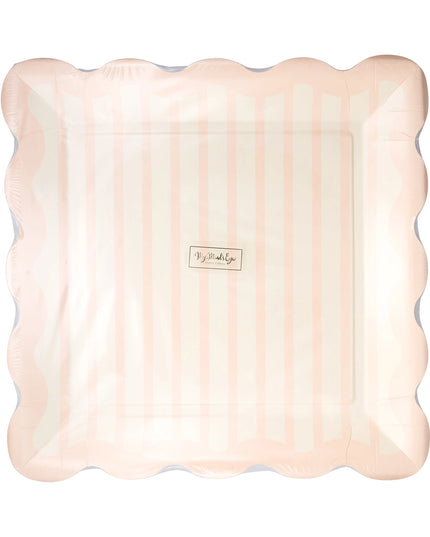 Pink scalloped edge paper plate with a brand label on a white background